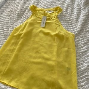 Yellow sleeveless top
